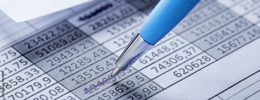 Accounting document with pen, money, coins and checking financial chart. Concept of banking, financial report and financial audit. Accounting document with pen, money, coins and checking financial chart. Concept of banking, financial report and financial audit.