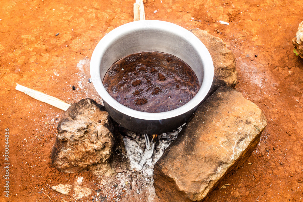 Coffee preparation at a farm in Sipi village, Uganda Coffee preparation at a farm in Sipi village, Uganda