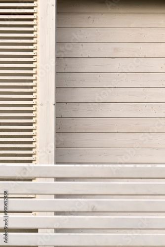 Close-up of modern wooden slatted wall design with horizontal and vertical lines