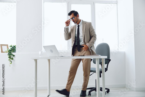Man corporate job businessman looking office business laptop happy suit winner technology background