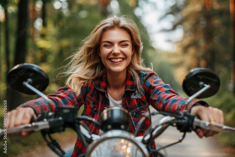 Naklejka premium Happy Woman Riding Motorcycle Outdoors Smiling in Forest Adventure, Freedom, Nature, Joy, Biking
