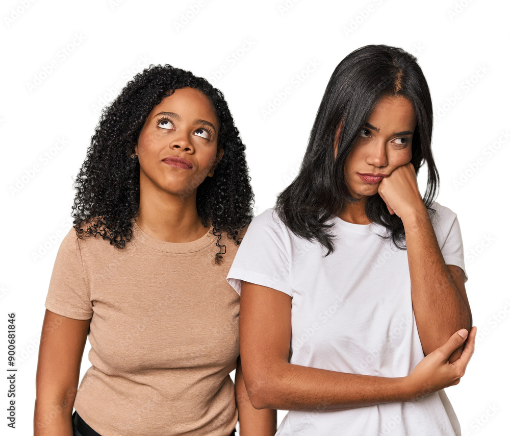 Young Latin friends in studio who feels sad and pensive, looking at copy space. Young Latin friends in studio who feels sad and pensive, looking at copy space.