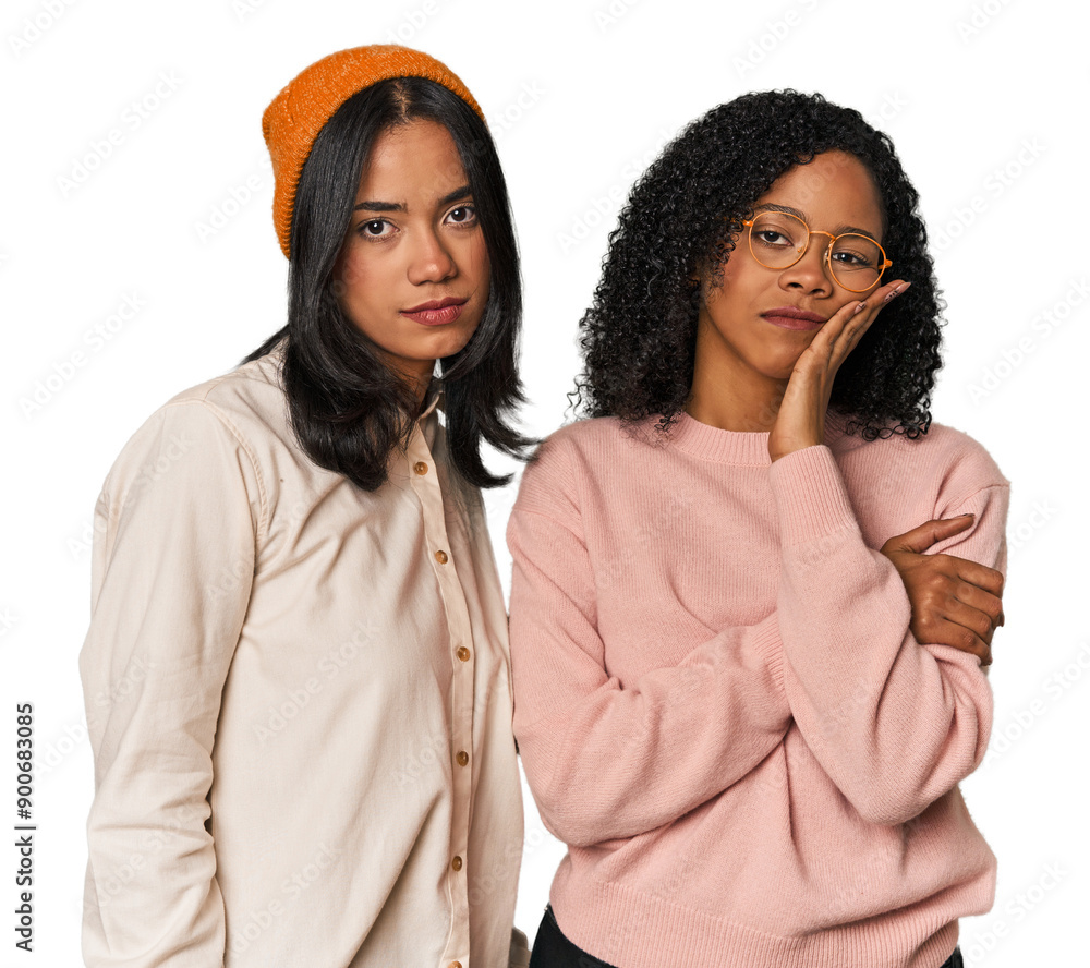 Young Latin friends together in studio who is bored, fatigued and need a relax day. Young Latin friends together in studio who is bored, fatigued and need a relax day.