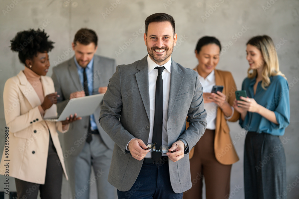 Portrait of multiethnic group of diverse corporate colleagues standing in a row at modern office Portrait of multiethnic group of diverse corporate colleagues standing in a row at modern office