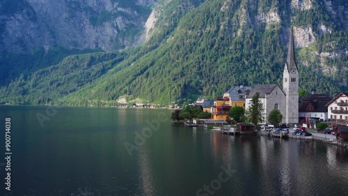 Wallpaper Mural Picturesque village by lake with towering mountains Torontodigital.ca