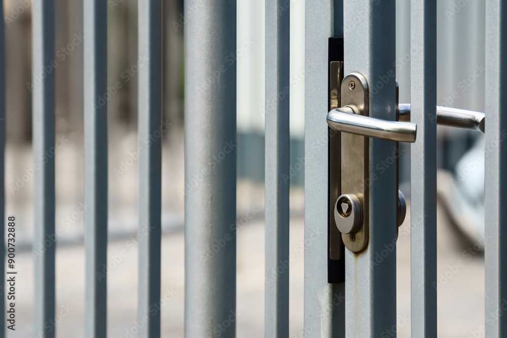 Metal fence with lock that opens with triangular key Metal fence with lock that opens with triangular key