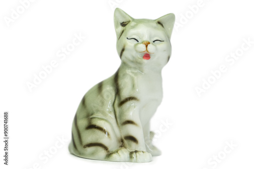 Antique figurine of a cat on a white isolated background. Vintage porcelain 