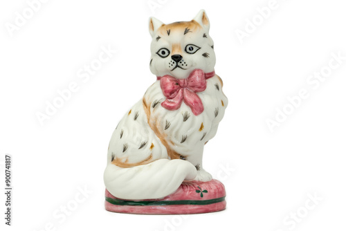 Antique figurine of a cat on a white isolated background. Vintage porcelain 