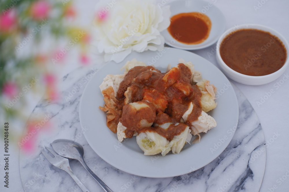 Siomay, Indonesian traditional street food with spicy peanut sauce Siomay, Indonesian traditional street food with spicy peanut sauce