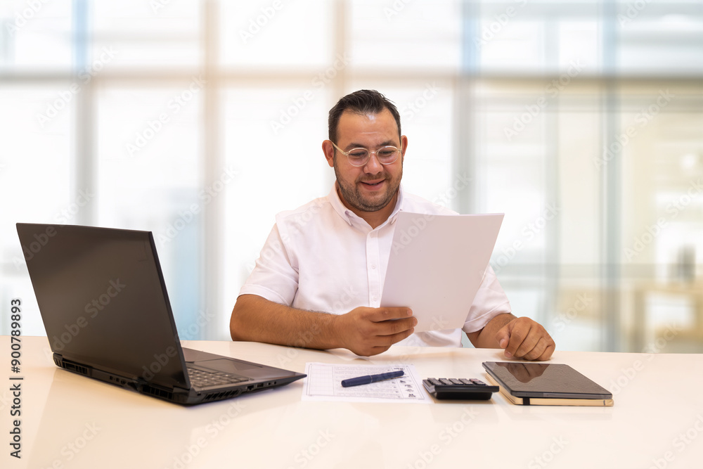 Business person smiles looking at the document in his hand. Notepads Business person smiles looking at the document in his hand. Notepads