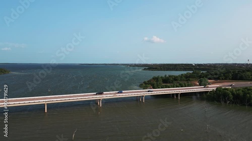 Tracking Shot of Lavon Lake Bridge and Cars photo