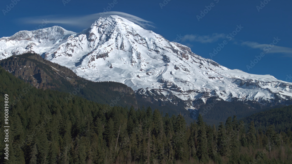 Fototapeta premium Majestic Snow-Covered Mount Rainier with Evergreen Forest in Foreground