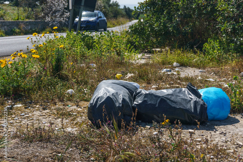 Waste of plastic bags dumped at roadside in Sicily, Italy