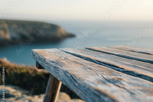 A compact style wood table positioned by a seaside cliff