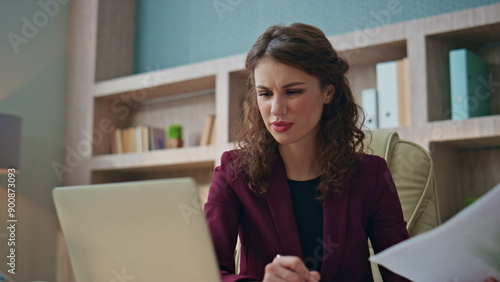Slika na platnu Unhappy businesswoman negotiating video call in office