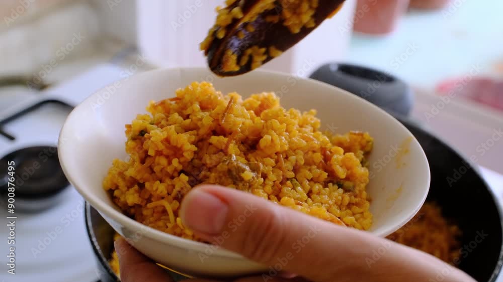 bulgur pilaf with meat filled into a bowl in close-up bulgur pilaf with meat filled into a bowl in close-up