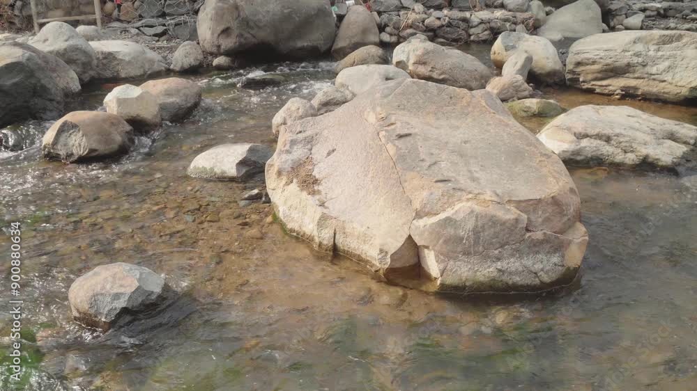 Tranquil stream with mossy rocks. Ideal for naturethemed designs, relaxation concepts, environmental campaigns, and water conservation projects. Tranquil stream with mossy rocks. Ideal for naturethemed designs, relaxation concepts, environmental campaigns, and water conservation projects.