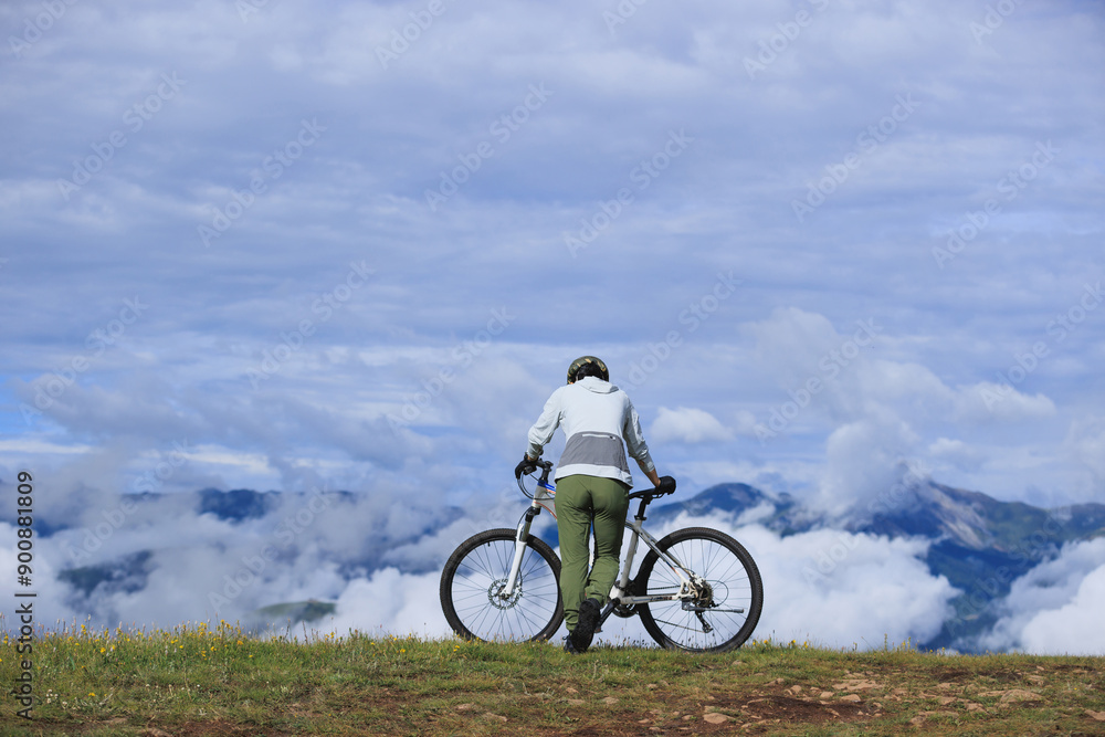 Riding mountain bike on beautiful mountain top Riding mountain bike on beautiful mountain top