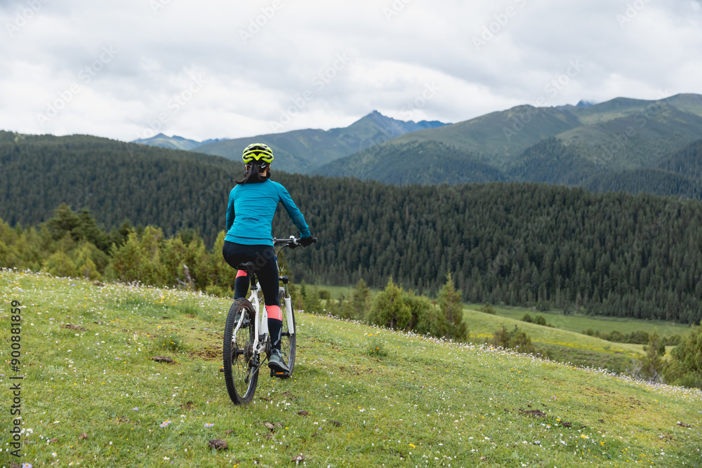 Riding mountain bike on beautiful forest mountain top Riding mountain bike on beautiful forest mountain top