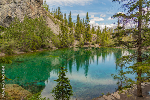 Breathtaking views of the upper and lower Grassi Lakes with brilliant turquoise and aqua waters set in a serene wilderness outside the town of Canmore near Kananaskis during the summer season. photo