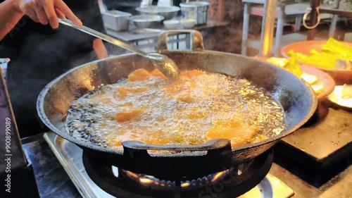 cooking in a frying pan with lots of oil