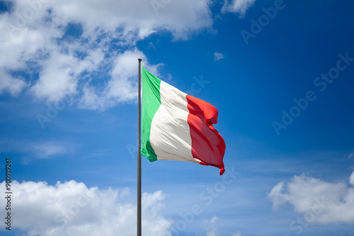 Wallpaper Mural Selective bur on Italian flag waving in the air against a blue sky in Italy, representing national pride and patriotism. It's the official flag and national symbol of the republic of italy. Torontodigital.ca