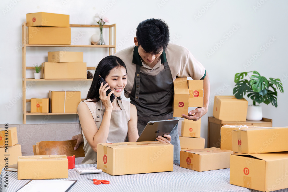 Business Startup owner Working From Home Packaging Products and Using mobile Business Startup owner Working From Home Packaging Products and Using mobile