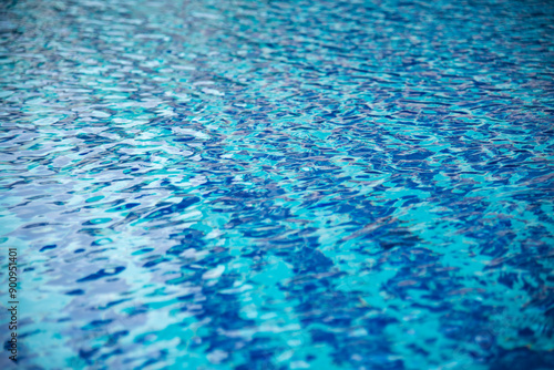 Poolside background Blue swimmimg pool reflection ripple wave underwater. Turquoise paradise shiny outdoors party in luxury hotel. Summer Outdoors lifestyle tourist vacation background swimming pool photo