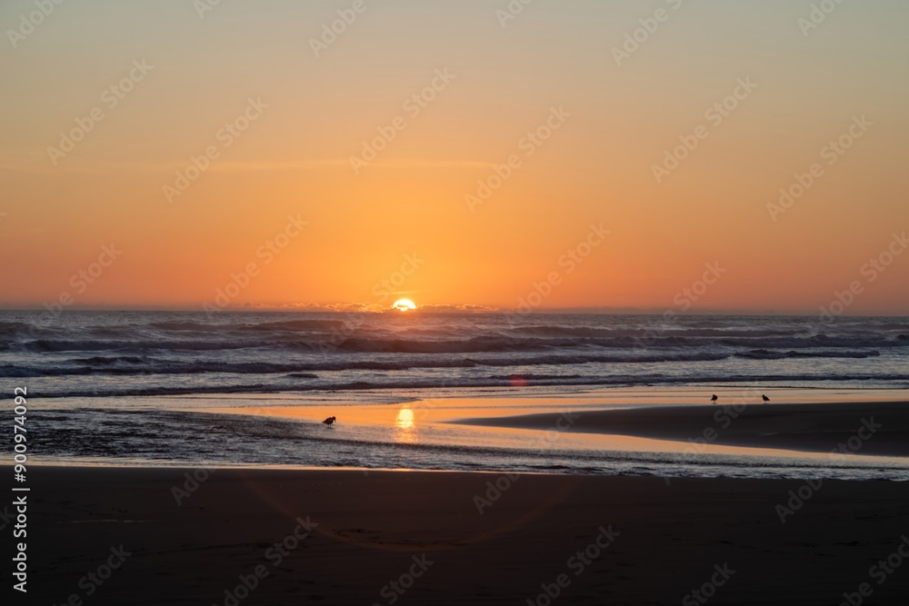 Coastal sandy beach of Anawhata at sunset, Piha, Auckland, New Zealand. Coastal sandy beach of Anawhata at sunset, Piha, Auckland, New Zealand.