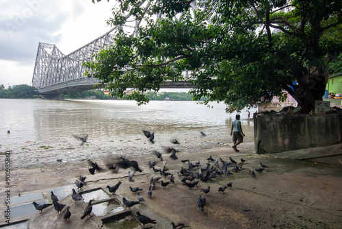 An iconic landmark in Kolkata, the Howrah Bridge is a huge steel bridge over the Hooghly River. It is considered to be one of the longest cantilever bridges in the world. Also known as Rabindra Setu photo