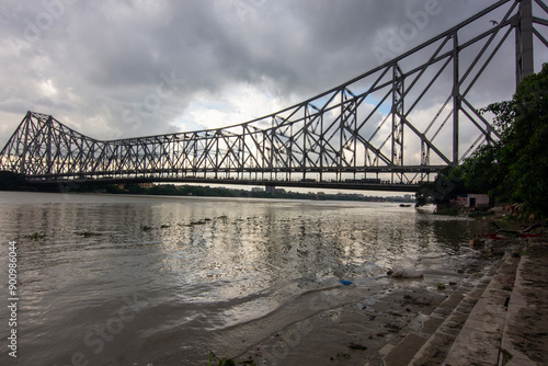 An iconic landmark in Kolkata, the Howrah Bridge is a huge steel bridge over the Hooghly River. It is considered to be one of the longest cantilever bridges in the world. Also known as Rabindra Setu photo