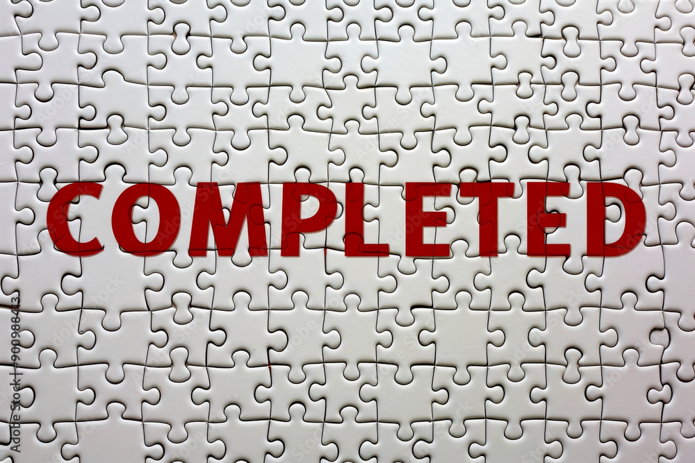 Fototapeta premium Jigsaw Puzzle with the word red COMPLETED.