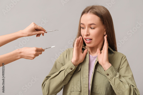 Shocked young woman and den...