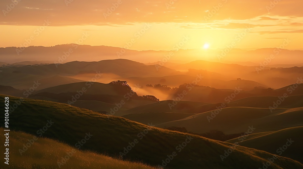 A breathtaking sunrise over rolling hills with wisps of fog in the distance. A breathtaking sunrise over rolling hills with wisps of fog in the distance.