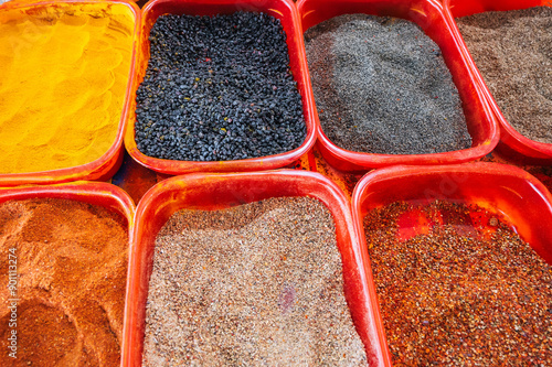 various colorful oriental turkish spices on the counter at the arabic bazaar in Turkey photo