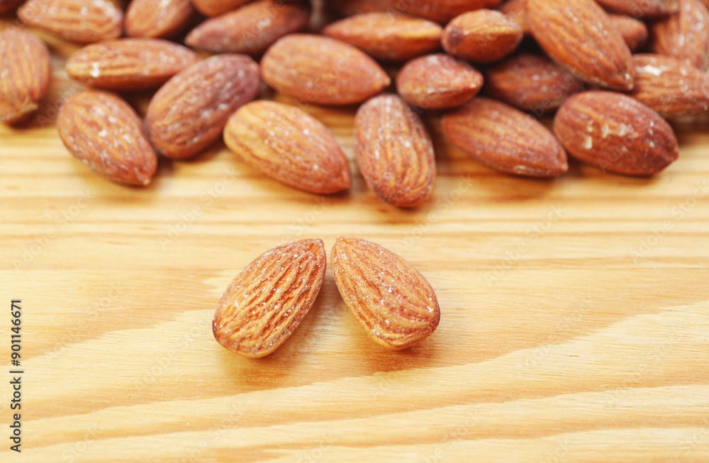 Closeup of Almond Nuts, one of a Nutrient-dense Foods and Good Source of Vegan Protein Closeup of Almond Nuts, one of a Nutrient-dense Foods and Good Source of Vegan Protein