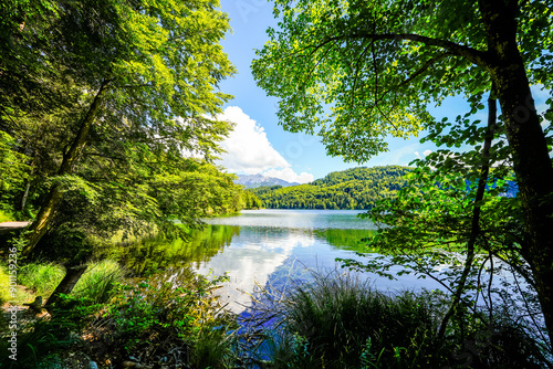 Landscape at Hechtsee near Kufstein. Clear mountain lake in Tyrol, Austria. Idyllic lake with the surrounding nature on the wooded plateau of the Thierberg.
 photo