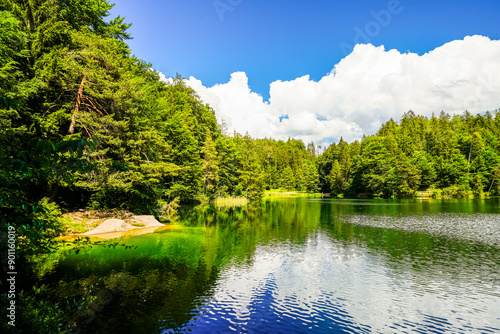 Landscape at Hechtsee near Kufstein. Clear mountain lake in Tyrol, Austria. Idyllic lake with the surrounding nature on the wooded plateau of the Thierberg.
 photo