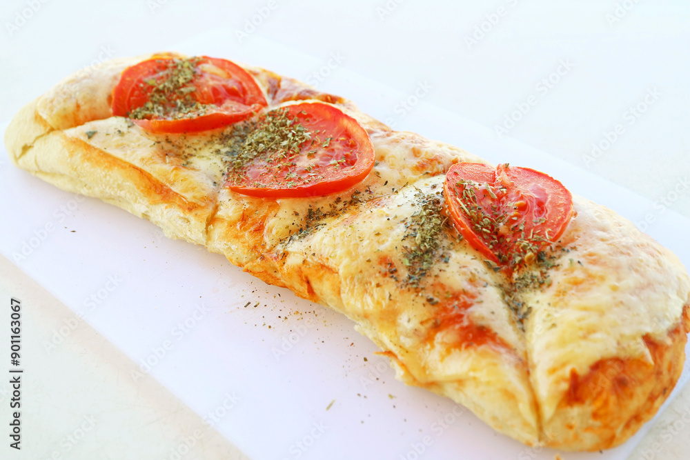 Delectable pizza stick with fresh tomato and herb Delectable pizza stick with fresh tomato and herb