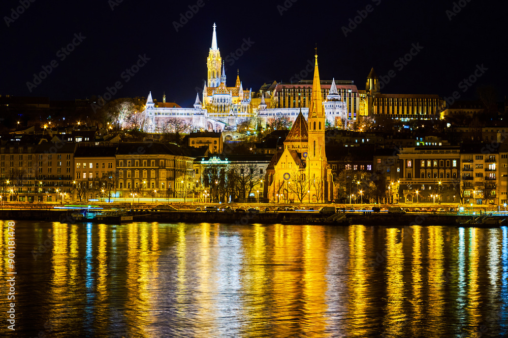 The view through Danube river on bright Fisherman's Bastion on the hill, Budapest, Hungary The view through Danube river on bright Fisherman's Bastion on the hill, Budapest, Hungary