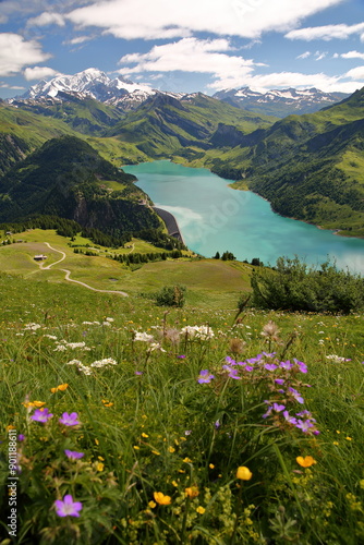 Obraz na płótnie The Mont Blanc and the lake of Roselend viewed from a hiking trail on a ridge leading to Roche Parstire, and located in the Beaufortain region, Savoie, France w salonie