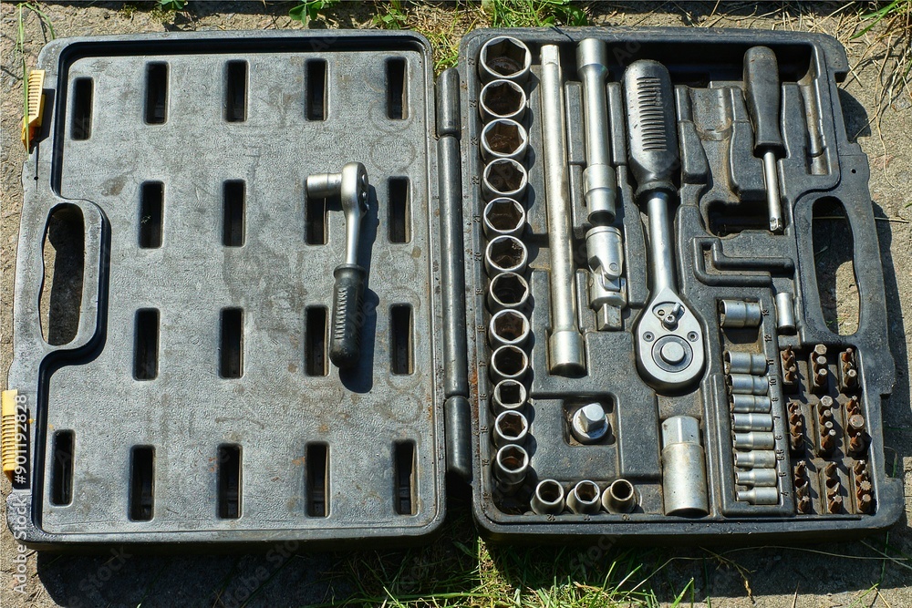 set of different new modern industrial iron hand mechanical wrenches for unscrewing bolts lie on an open dirty plastic black box set of different new modern industrial iron hand mechanical wrenches for unscrewing bolts lie on an open dirty plastic black box