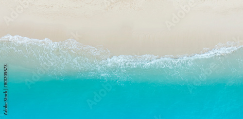Fototapeta Naklejka Na Ścianę i Meble -  Tropical Beach with the soft wave water of the sea on the sandy beach background as texture with splashes and bubbles