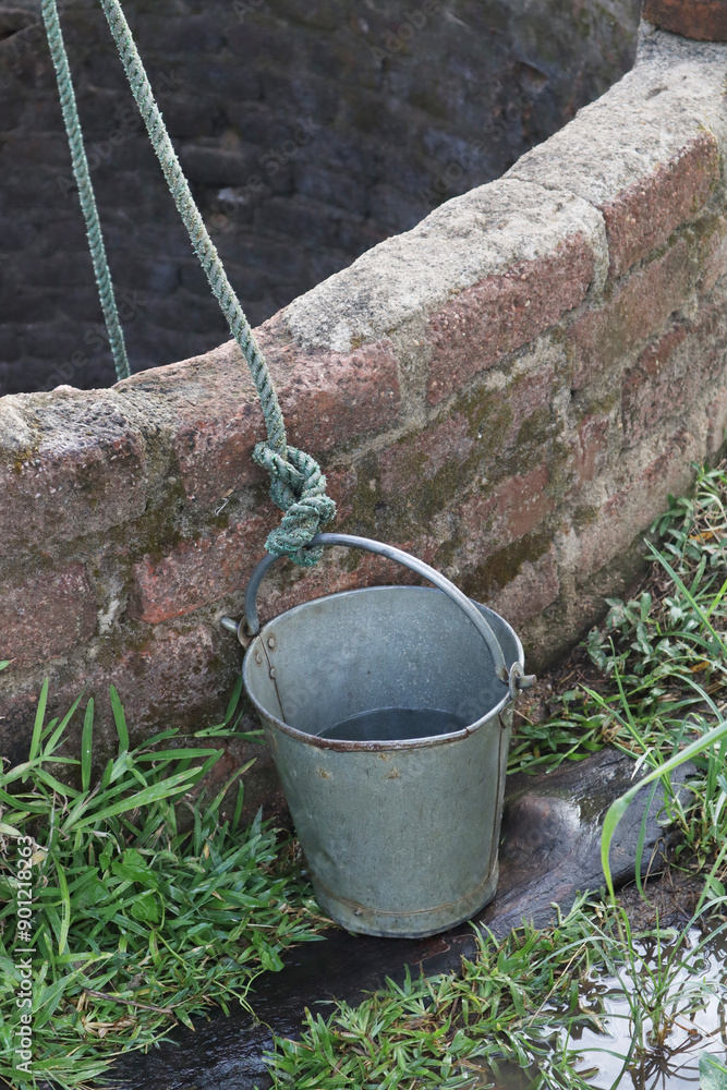 A bucket to take water from a deep water well A bucket to take water from a deep water well