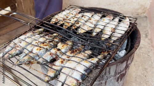 Cooking the grilled sardines. A traditional Moroccan recipe