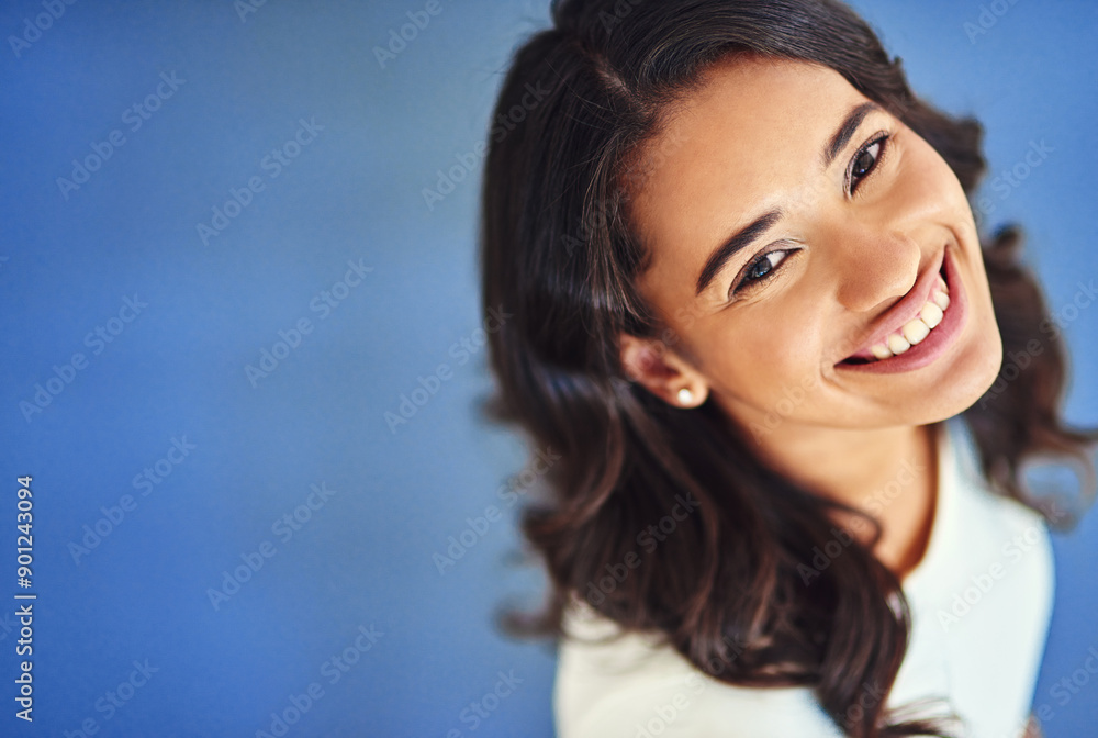 Woman, smile and above portrait in studio, corporate employee and mock up space with administrator. Happy, office career and professional on blue background, ambition and business receptionist Woman, smile and above portrait in studio, corporate employee and mock up space with administrator. Happy, office career and professional on blue background, ambition and business receptionist