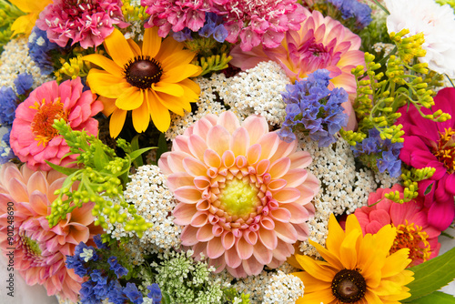 Summer bouquet. Beautiful multi colored fresh flower arrangement. Locally sourced flowers birthday bouquet close up.