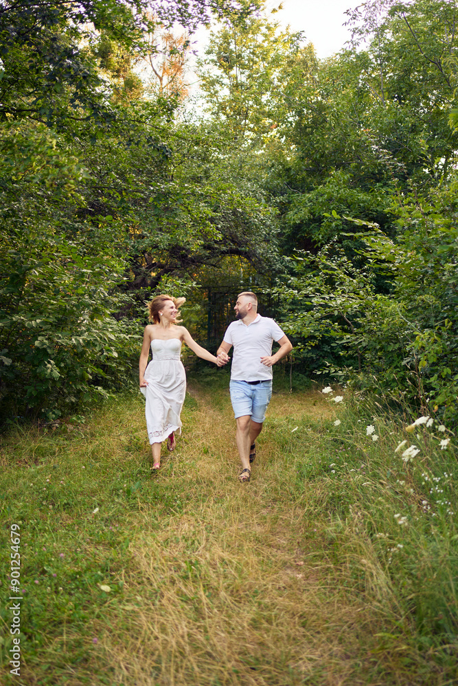 a 30-year-old couple in love in the garden a 30-year-old couple in love in the garden
