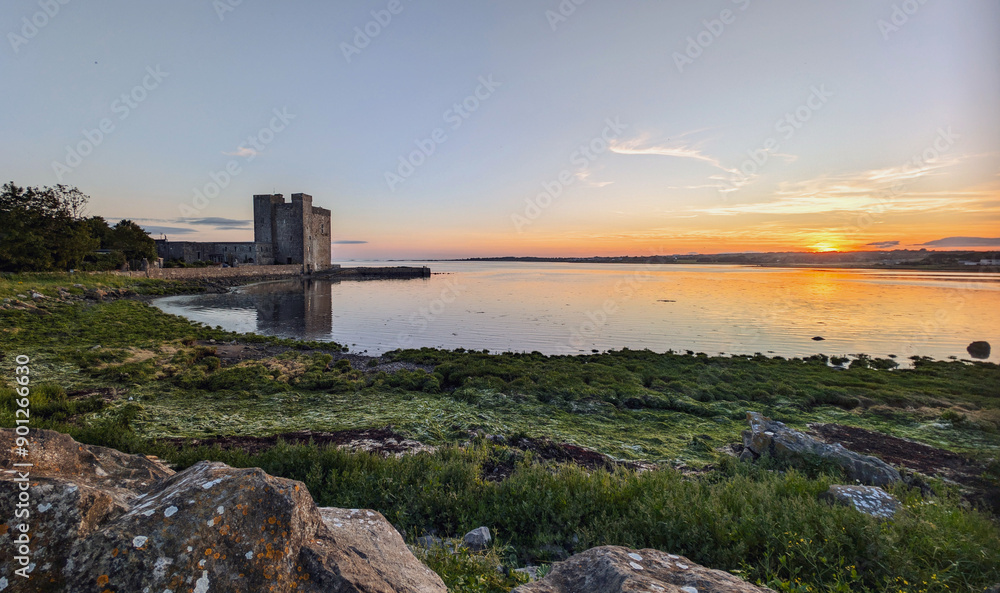 Beautiful coastal sunset scenery with historical landmark Oranmore castle at Galway bay, Ireland, Wild Atlantic way, buildings and architecture background, wallpaper