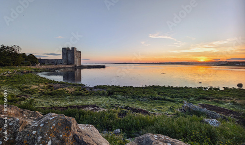 Obraz na płótnie Beautiful coastal sunset scenery with historical landmark Oranmore castle at Galway bay, Ireland, Wild Atlantic way, buildings and architecture background, wallpaper w salonie
